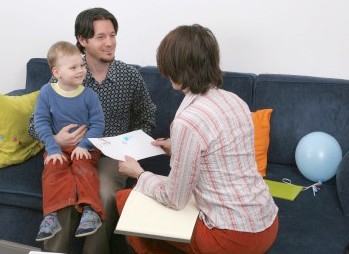 socialworkerjobs lady helping a family doing social work