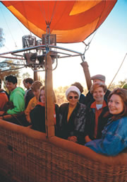 people in a ballooning basket