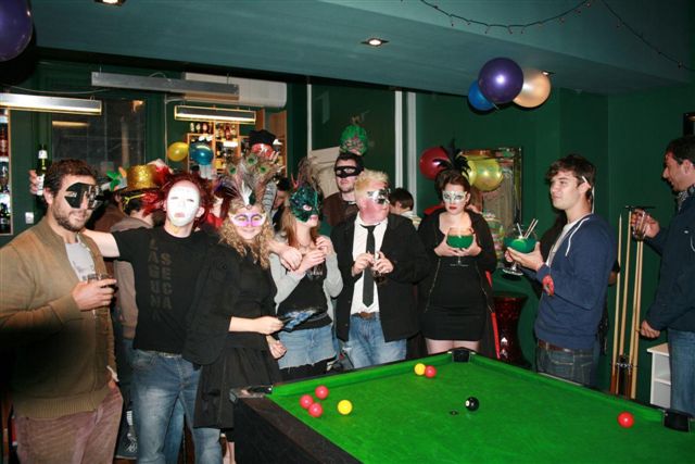 people playing pool at back of chapel hostel