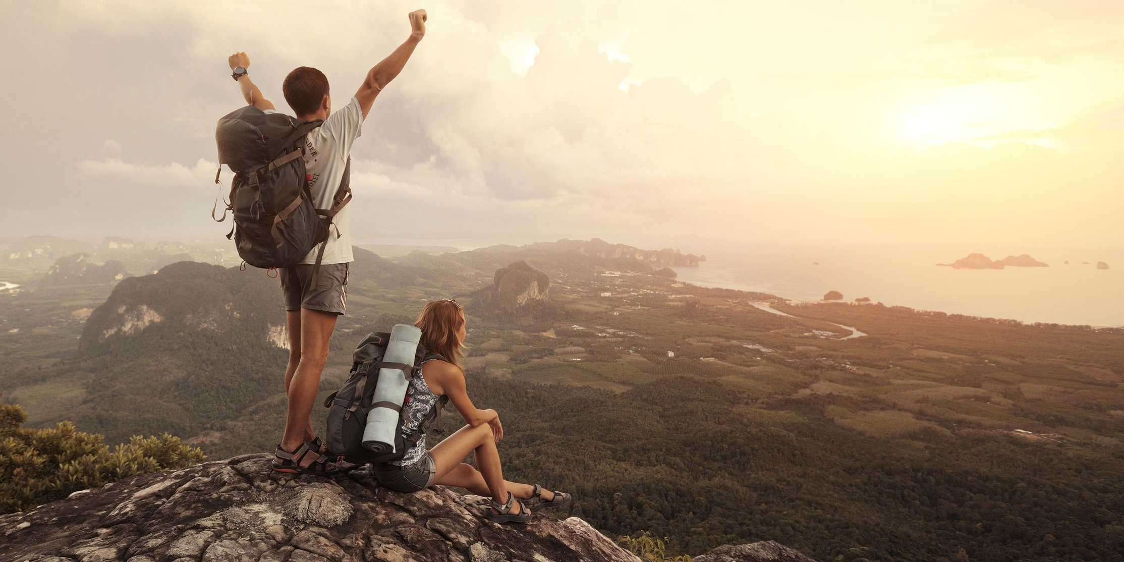 Couple with backpacks on top of mountain Superannuation What is a Australian superannuation fund?