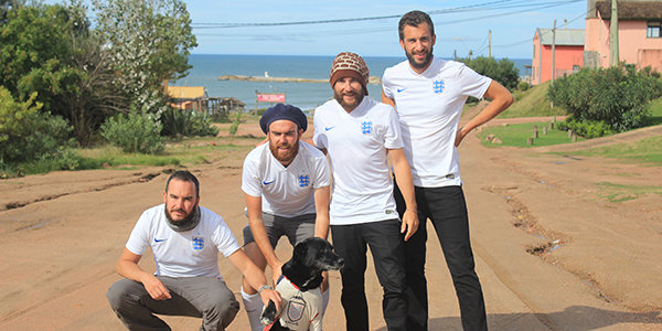 Four men football shirts dog