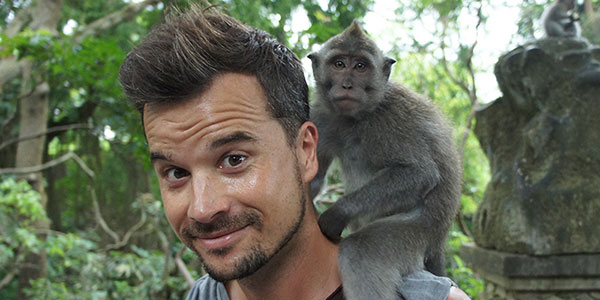 Balintro-monkey man with monkey on his shoulder in Bali