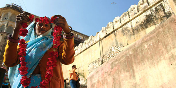 Geckos-Local-woman-with-flowers-in indian woman