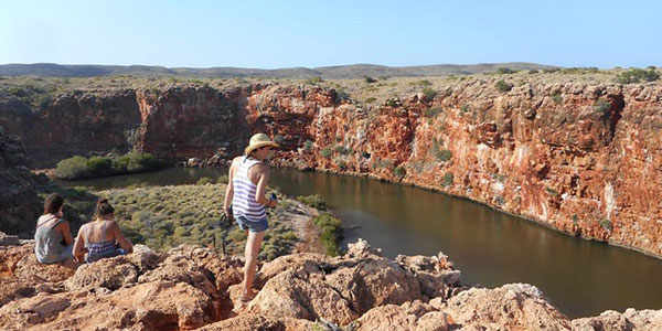 Outback-Camp-Tours-Gorge girl standing over a gorge in western australia