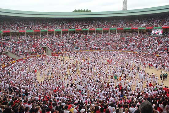 crowd in the bullring of running of the bulls spain