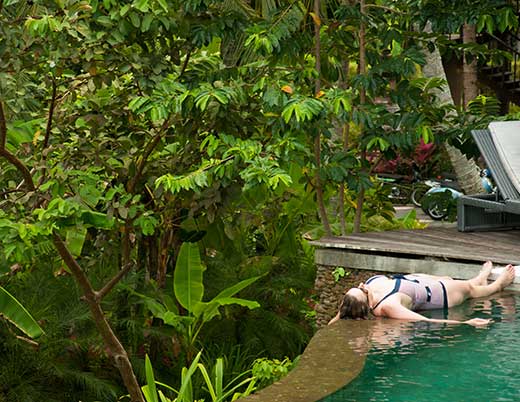 woman lying by pool