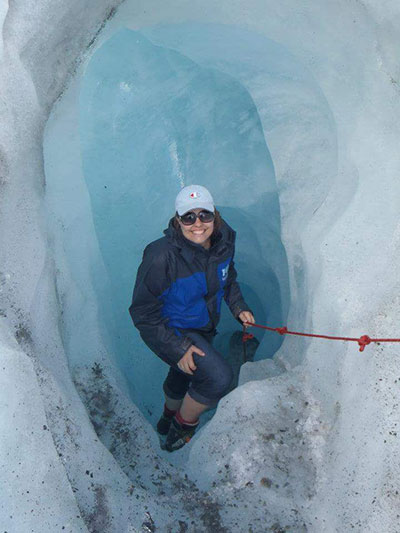 woman climbing franz josef in new zealand