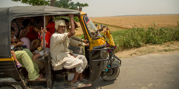 locals in india travelling by rickshaw
