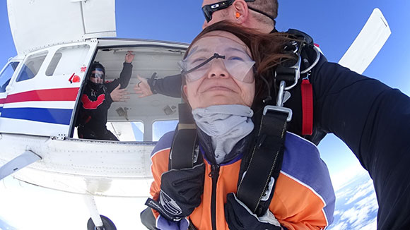 girl tandem skydiving