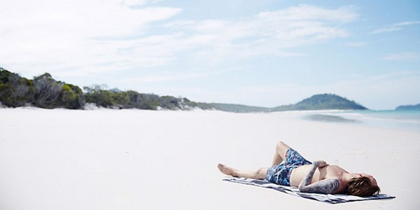 avicii avicii lying on whitehaven beach