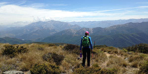 woman looking at mountain view in new zealand