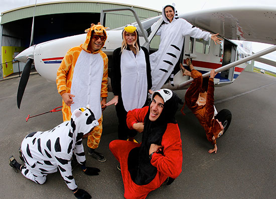 group wearing onesies to go skydiving