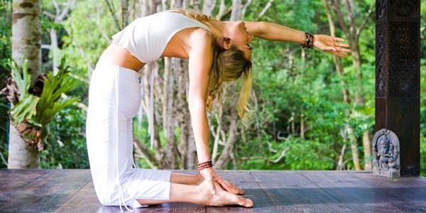 woman doing yoga on holiday