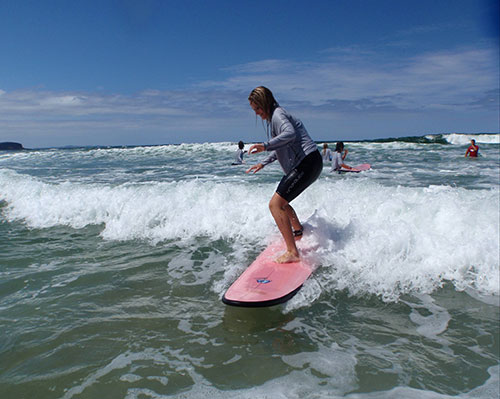 girl learning to surf on east coast australia