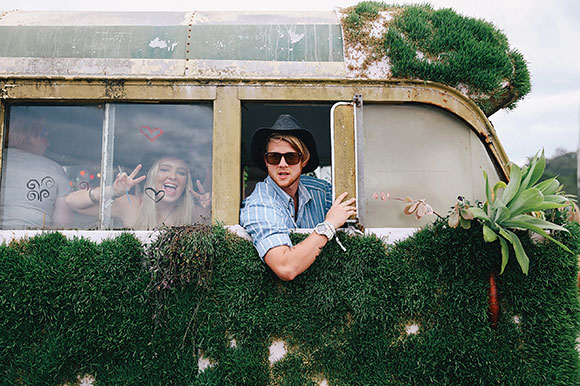 people sitting in a van in summer