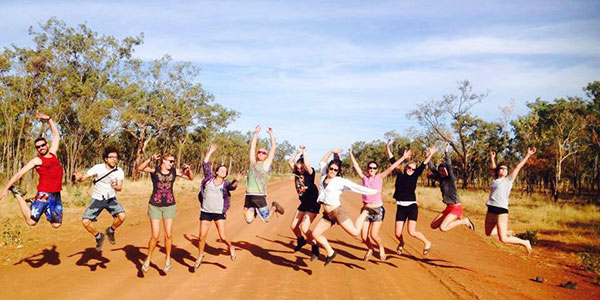 aussie-wanderer-Gibb-Jump people jumping on desert road in australia