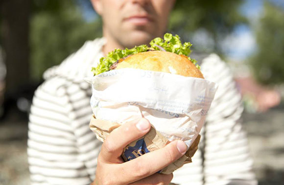 holding a fergburger in new zealand