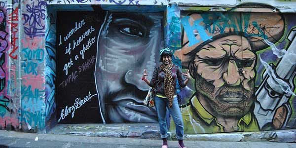 expat-interview-sandy-street-art Woman standing in front of street art in Melbourne