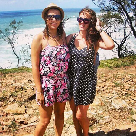 friends standing on the beach on fraser island