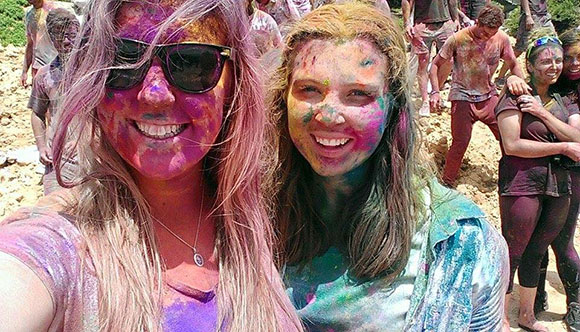 girls covered in paint in india