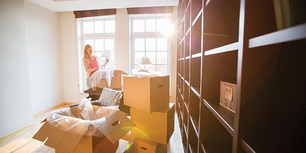woman moving house with boxes