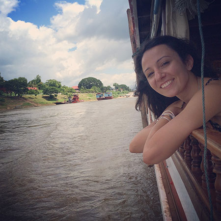 girl on a boat trip in Laos