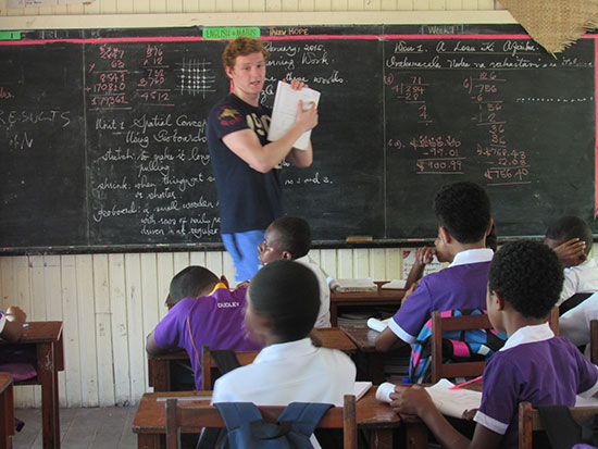 volunteer teaching school children in fiji