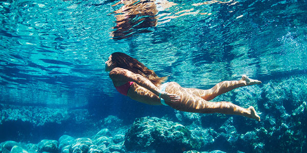girl swimming underwater