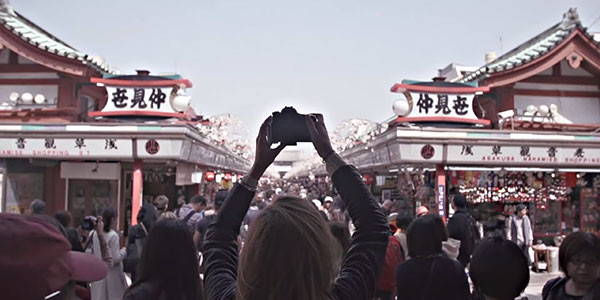 girl taking a photo in japan