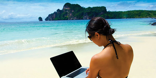 girl-on-beach-with-laptop-(2) girl sitting on the beach with a laptop