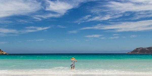 girl standing on beach in australia