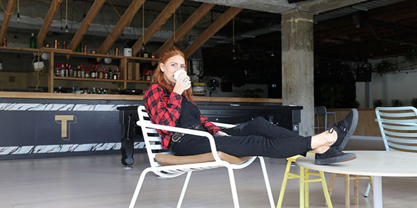 lauren-crocker-beach-road-bondi girl sitting on cafe furniture