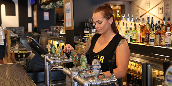 girl behind a bar