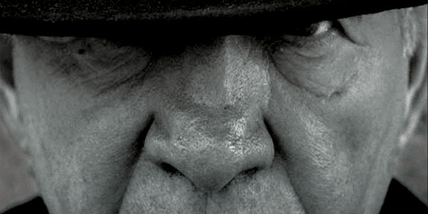 old man staring into camera