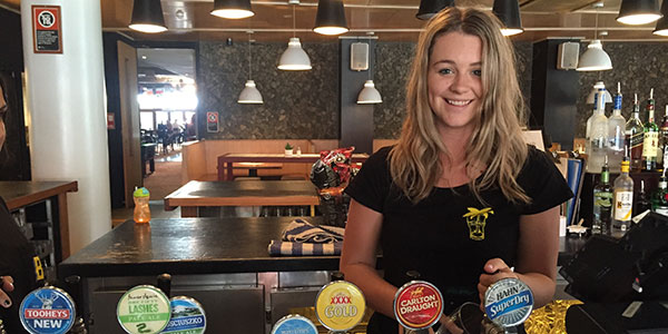 girl behind a bar