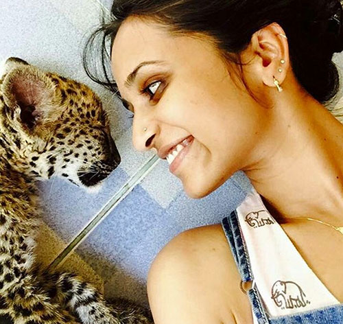 volunteer with leopard cub