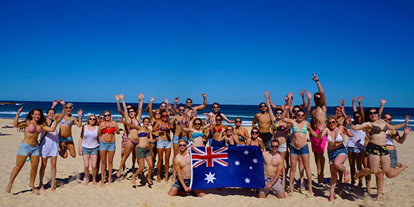 ozintro-australia-flag-beach travellers in australia