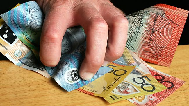 tax-return-2 a hand holding australian money