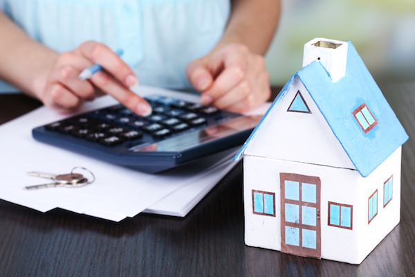Counting property prices a man calculating property taxes