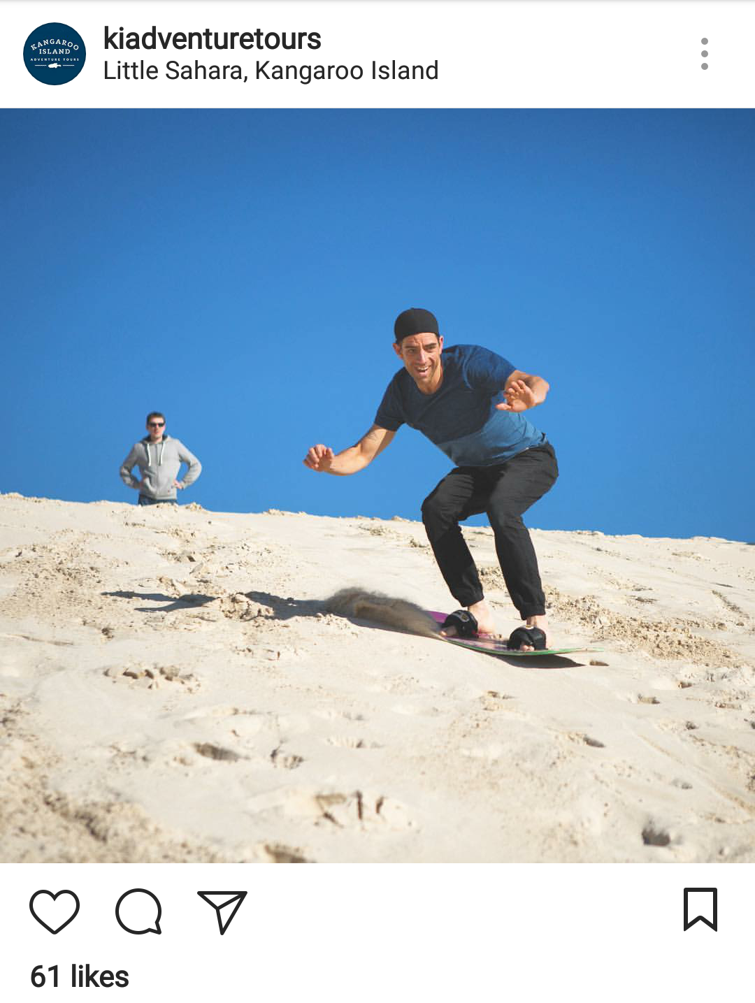 Sand-boarding down a sand dune