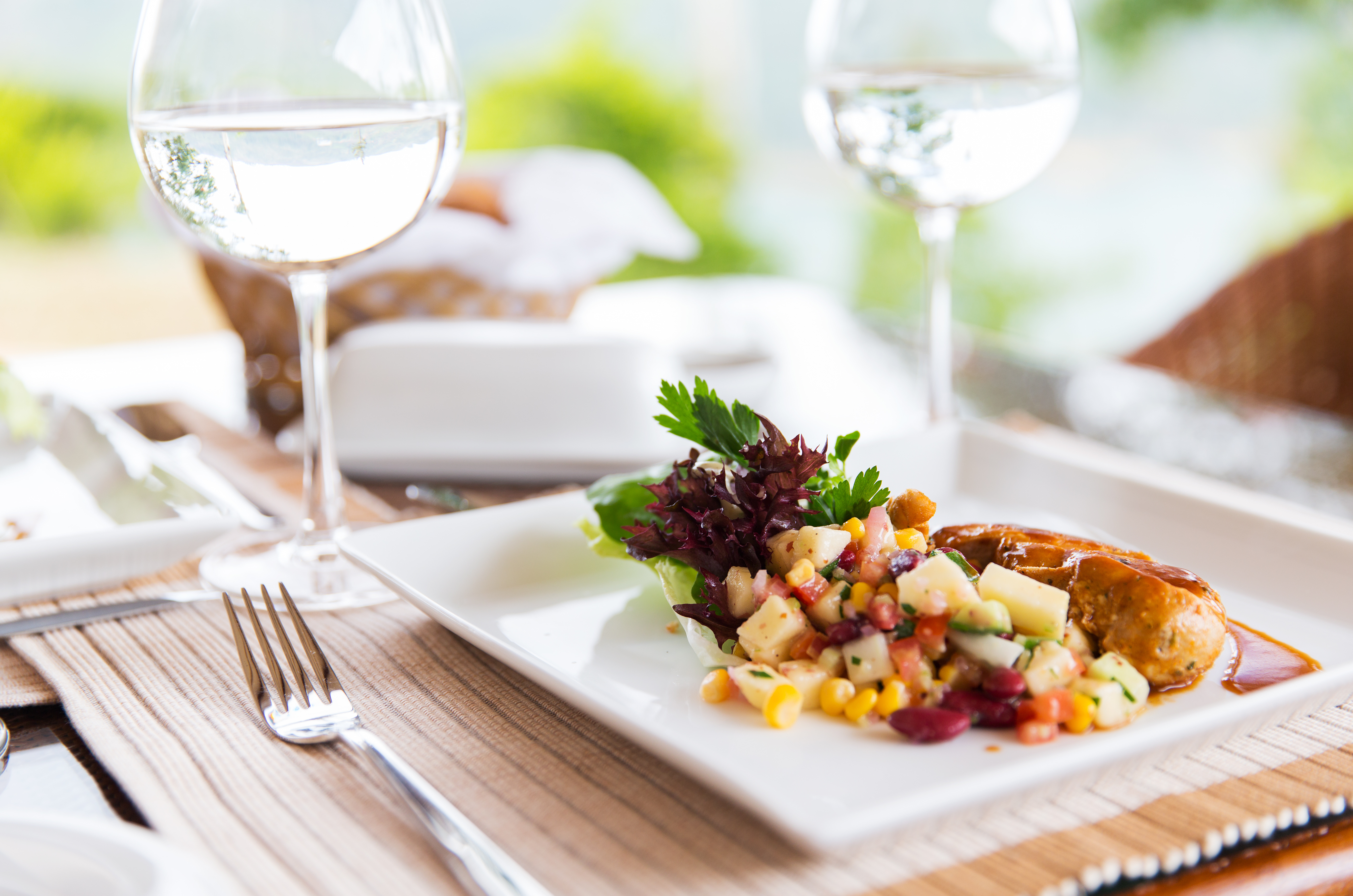 close up of food and water glasses at restaurant